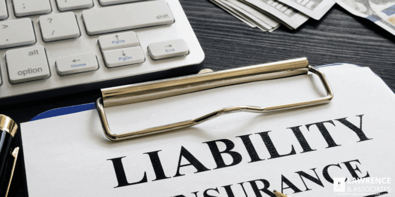 Paper on clipboard with the word 'liability insurance' on it